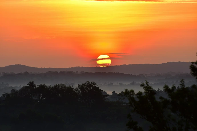a sunset over Kibale forest
