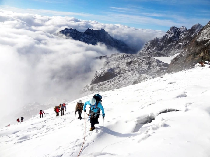 people climbing the snow peak Mt. Rwenzori