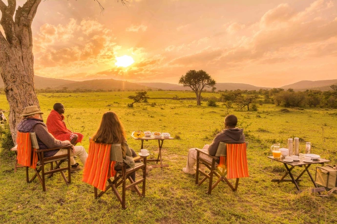 A couple having bush breakfast in Masai Mara